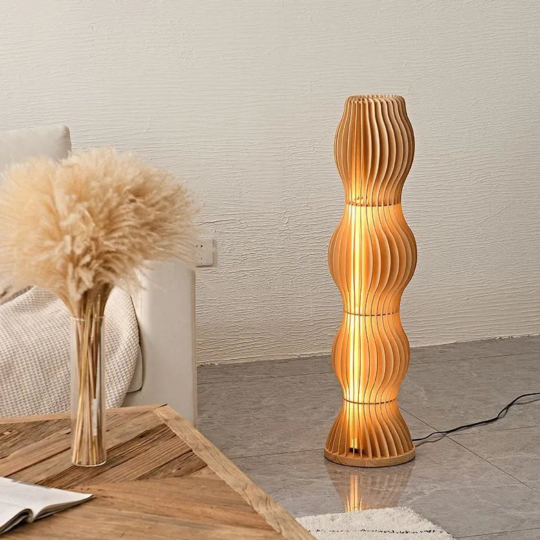 Lampada da pavimento scultoree a forma di onda in legno